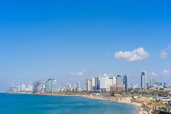 city skyline across blue sea under blue sky.jpg